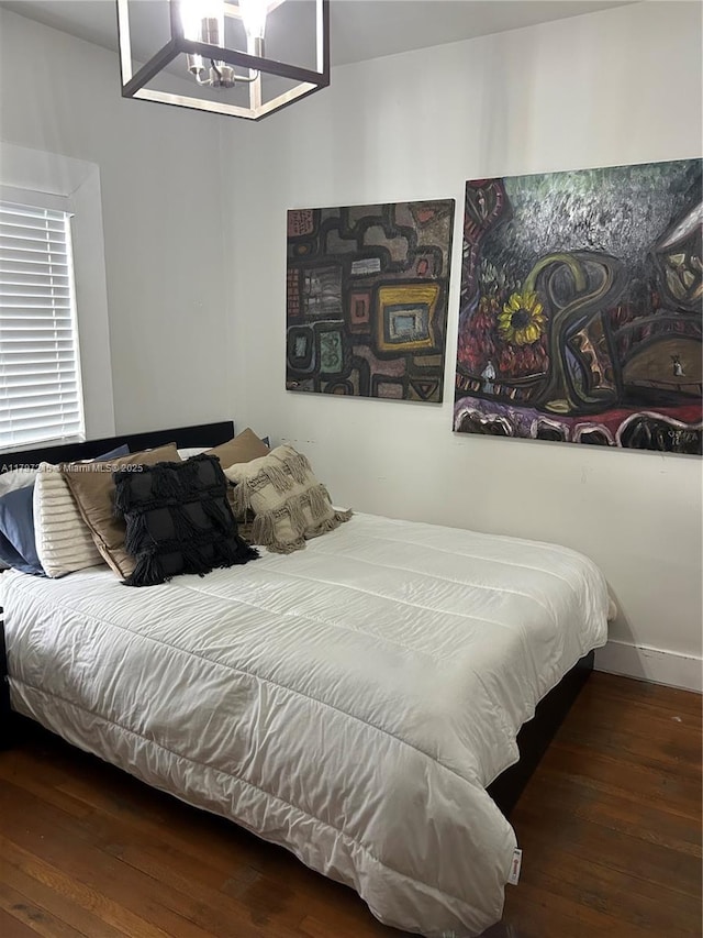2320 SW 16th Ter, Miami, FL 33145 - bedroom featuring hardwood / wood-style floors and a chandelier