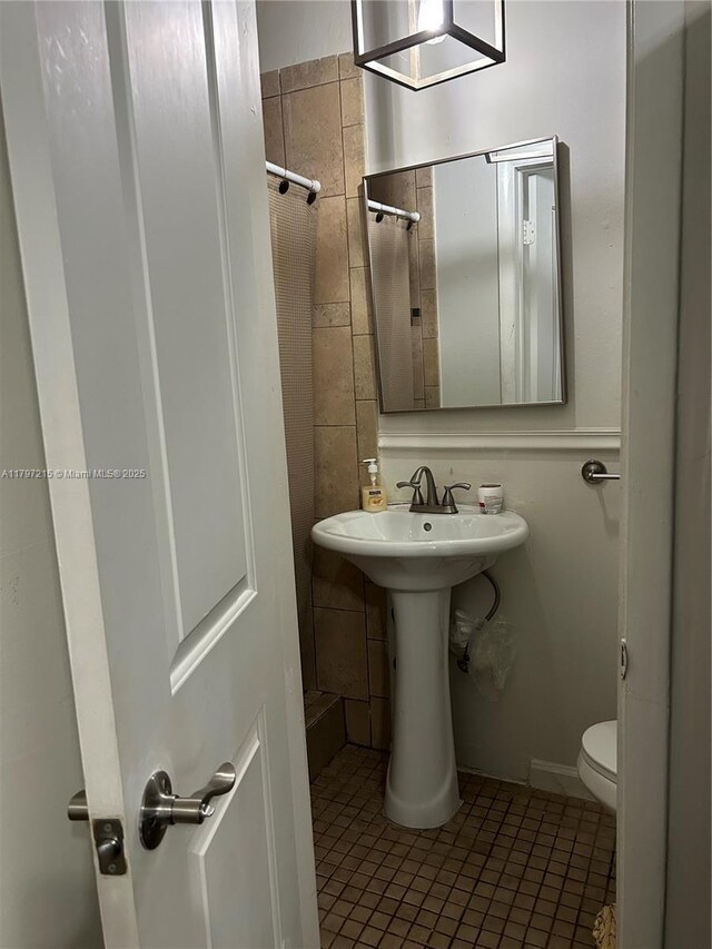 2320 SW 16th Ter, Miami, FL 33145 - bathroom with tile patterned flooring and tile walls