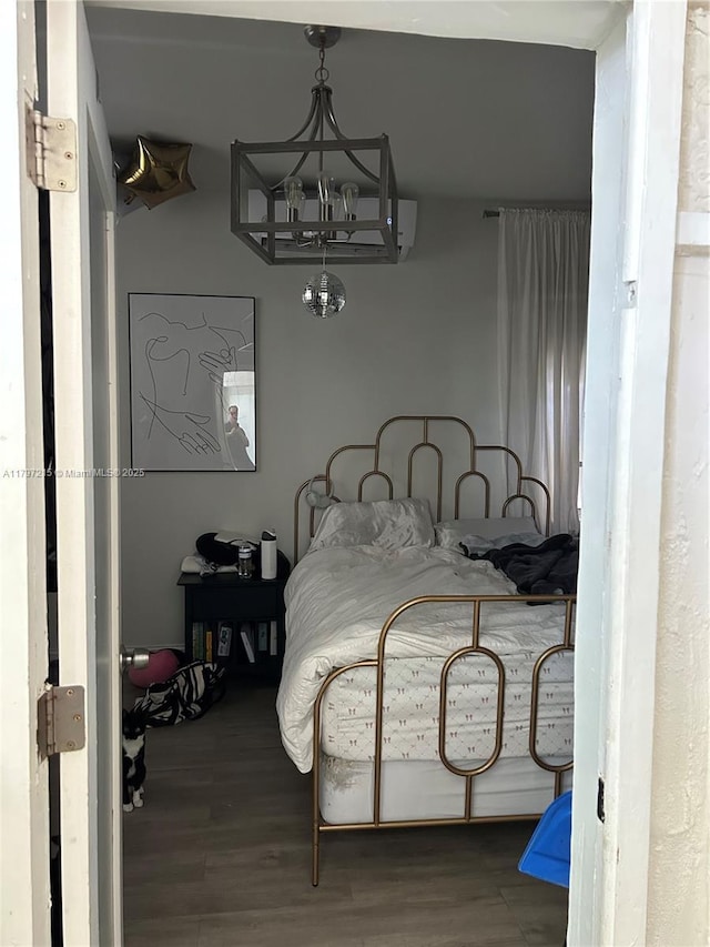 2320 SW 16th Ter, Miami, FL 33145 - bedroom with wood finished floors and a chandelier
