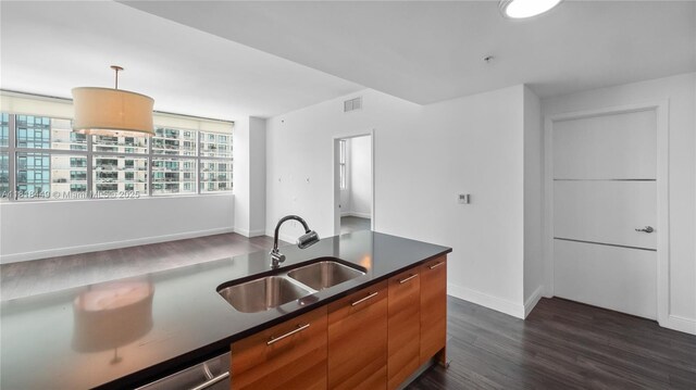 3301 NE 1st Ave Unit H1612, Miami, FL 33137 - kitchen with a sink, dark countertops, dark wood-style flooring, modern cabinets, and decorative light fixtures