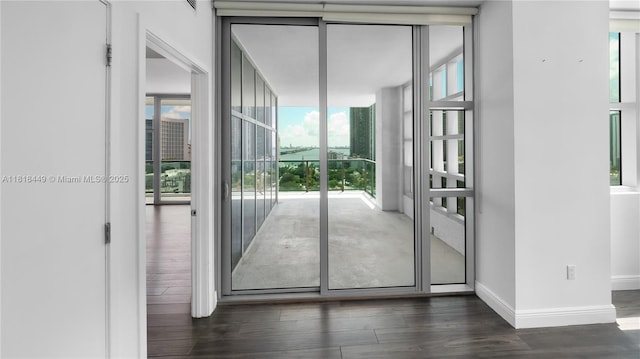 3301 NE 1st Ave Unit H1612, Miami, FL 33137 - entryway featuring plenty of natural light, wood finished floors, and baseboards