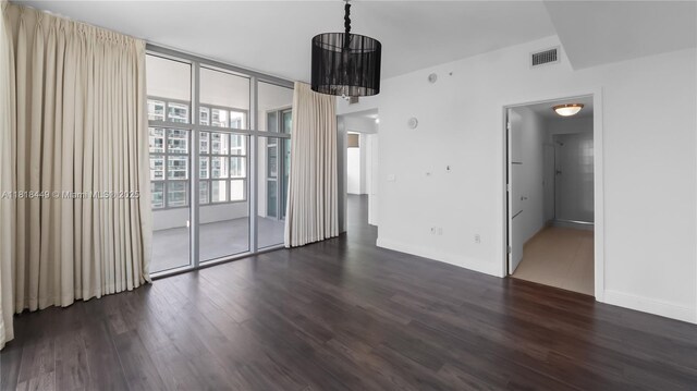 3301 NE 1st Ave Unit H1612, Miami, FL 33137 - unfurnished room with dark wood-type flooring and baseboards