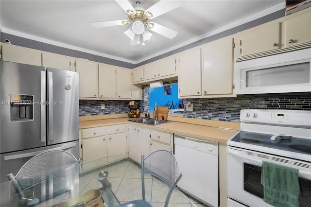8415 SW 107th Ave Unit 323W, Miami, FL 33173 - kitchen featuring white appliances, a sink, light countertops, and backsplash