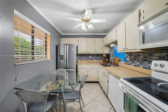 8415 SW 107th Ave Unit 323W, Miami, FL 33173 - kitchen with white appliances, a sink, decorative backsplash, light countertops, and ceiling fan