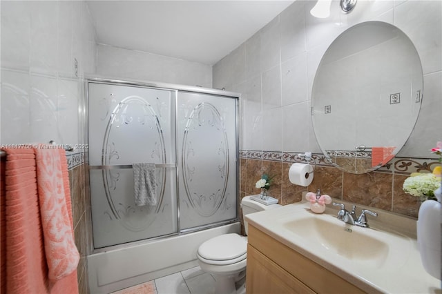 8415 SW 107th Ave Unit 323W, Miami, FL 33173 - full bath with tile walls, vanity, toilet, bath / shower combo with glass door, and backsplash