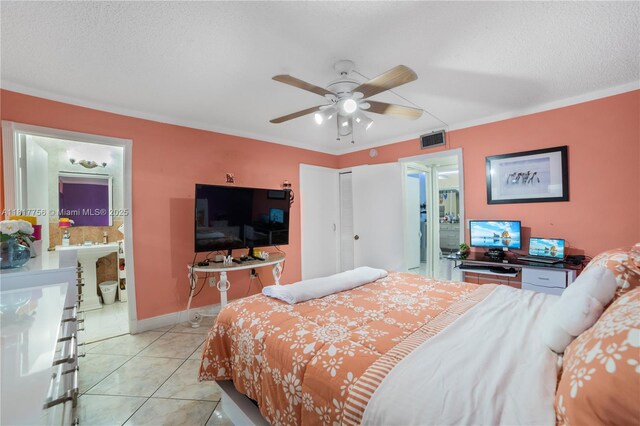 8415 SW 107th Ave Unit 323W, Miami, FL 33173 - bedroom featuring light tile patterned floors, a closet, ceiling fan, baseboards, and a textured ceiling