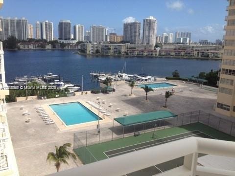 18051 Biscayne Blvd Unit 803, Aventura, FL 33161 - community pool with a water view, a view of skyline, and a patio area