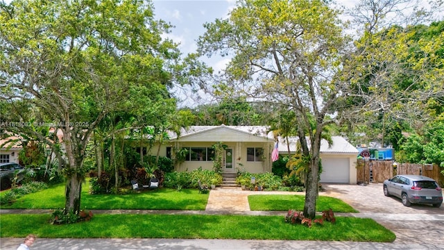 4240 SW 9th St, Plantation, FL 33317 - view of front of property with decorative driveway, an attached garage, and stucco siding
