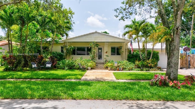 4240 SW 9th St, Plantation, FL 33317 - view of front of home with a front lawn