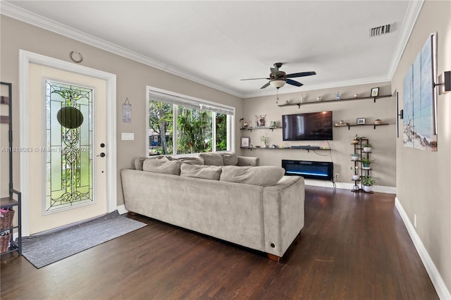 4240 SW 9th St, Plantation, FL 33317 - living area featuring dark wood-style flooring, crown molding, ceiling fan, and a glass covered fireplace
