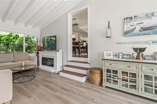 4240 SW 9th St, Plantation, FL 33317 - living room with wood finished floors, healthy amount of natural light, and a glass covered fireplace