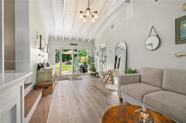 4240 SW 9th St, Plantation, FL 33317 - living area with a chandelier, wood finished floors, a wood ceiling with exposed beams, and high vaulted ceiling