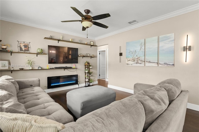 4240 SW 9th St, Plantation, FL 33317 - living room with dark wood finished floors, a ceiling fan, crown molding, and a glass covered fireplace
