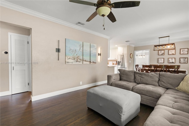 4240 SW 9th St, Plantation, FL 33317 - living area featuring dark wood finished floors, ornamental molding, ceiling fan, and a chandelier
