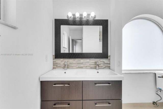 3075 SW 19th St, Miami, FL 33145 - bathroom with double vanity and backsplash