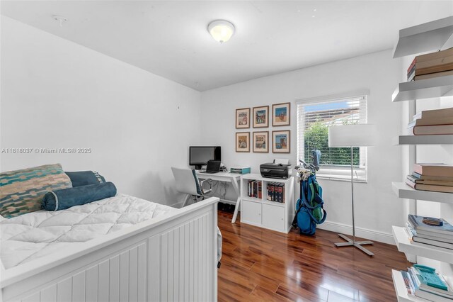 3075 SW 19th St, Miami, FL 33145 - bedroom with an office area and wood finished floors