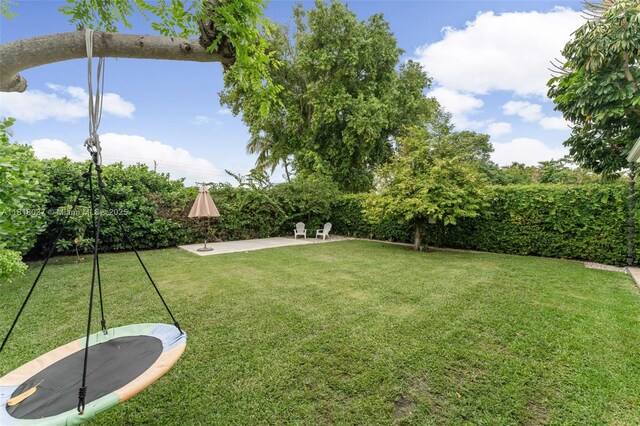 3075 SW 19th St, Miami, FL 33145 - view of green lawn featuring a patio area