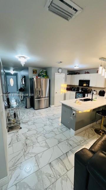 1908 NE 2nd Pl, Cape Coral, FL 33909 - living area with light marble finish flooring