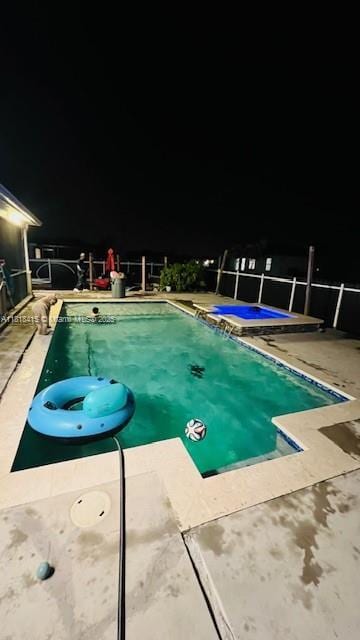 1908 NE 2nd Pl, Cape Coral, FL 33909 - view of swimming pool featuring a jacuzzi and a patio