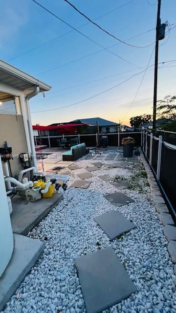 1908 NE 2nd Pl, Cape Coral, FL 33909 - fenced backyard featuring a patio area