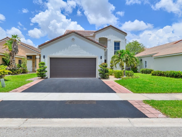 624 Stanton Dr, Weston, FL 33326 - mediterranean / spanish-style house with stucco siding, asphalt driveway, a front yard, an attached garage, and a tiled roof