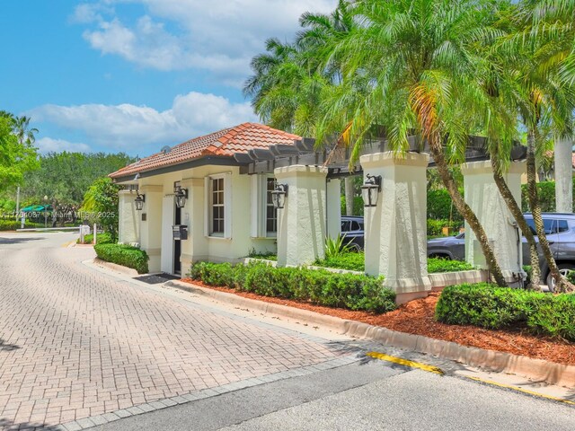 624 Stanton Dr, Weston, FL 33326 - mediterranean / spanish-style home with a tile roof and stucco siding
