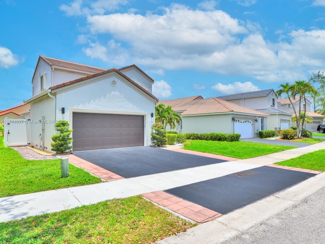 624 Stanton Dr, Weston, FL 33326 - mediterranean / spanish home with driveway, an attached garage, stucco siding, and a front yard