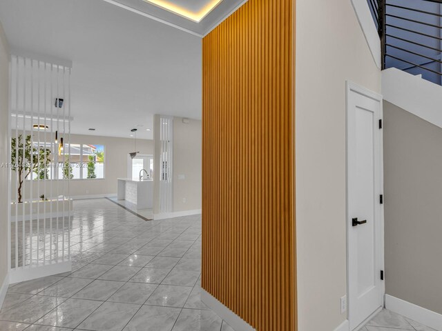 624 Stanton Dr, Weston, FL 33326 - hallway with light marble finish floors and baseboards