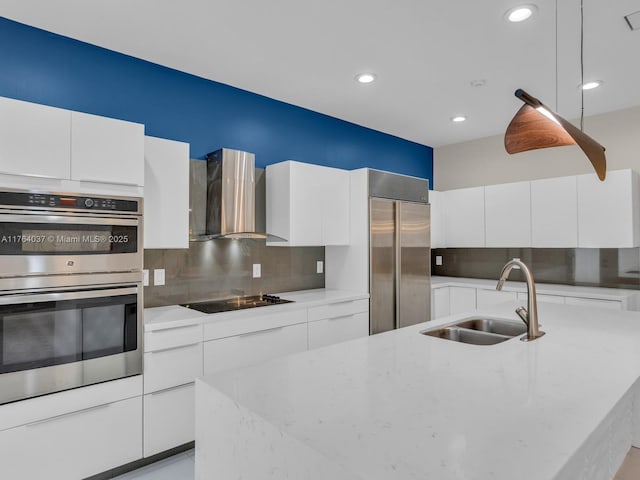 624 Stanton Dr, Weston, FL 33326 - kitchen featuring stainless steel appliances, wall chimney exhaust hood, modern cabinets, decorative backsplash, and recessed lighting