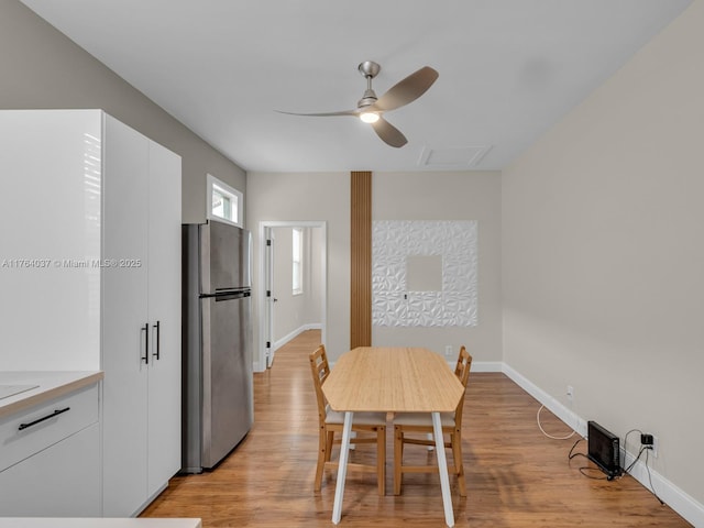 624 Stanton Dr, Weston, FL 33326 - dining room featuring a ceiling fan, light wood-style flooring, and attic access