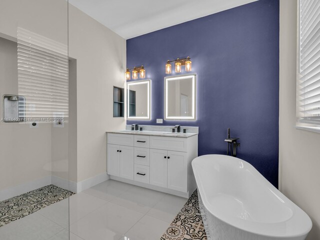 624 Stanton Dr, Weston, FL 33326 - bathroom featuring a freestanding tub, double vanity, and tile patterned flooring