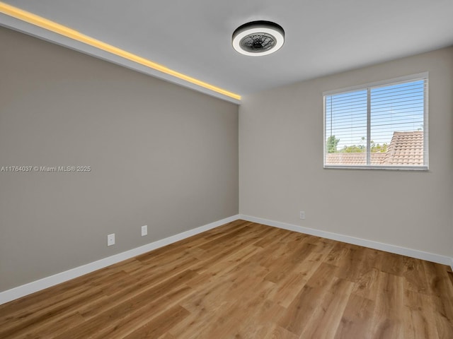 624 Stanton Dr, Weston, FL 33326 - unfurnished room featuring baseboards and wood finished floors