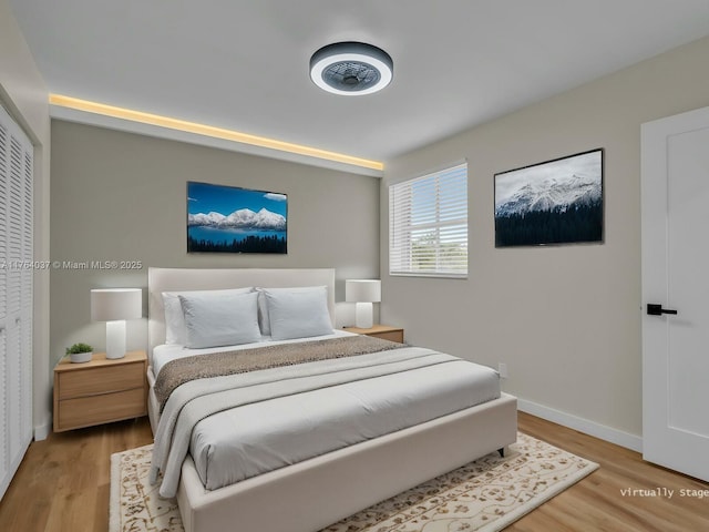 624 Stanton Dr, Weston, FL 33326 - bedroom featuring light wood-style flooring and baseboards