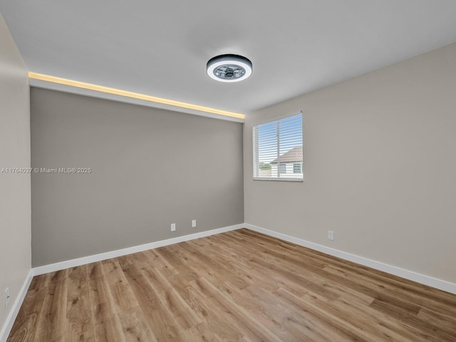 624 Stanton Dr, Weston, FL 33326 - spare room featuring wood finished floors and baseboards