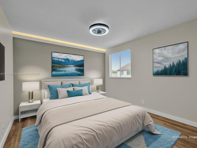 624 Stanton Dr, Weston, FL 33326 - bedroom with baseboards and wood finished floors