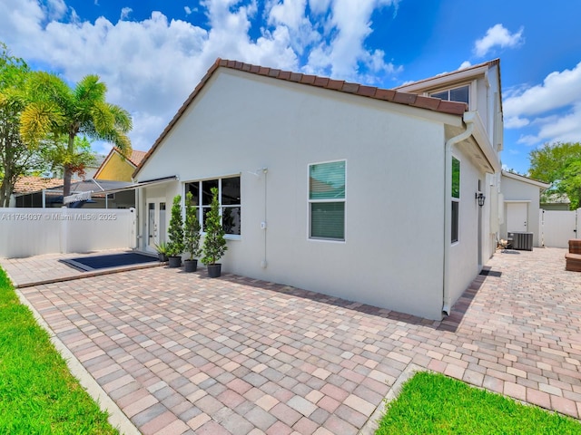 624 Stanton Dr, Weston, FL 33326 - rear view of house featuring a patio area and stucco siding