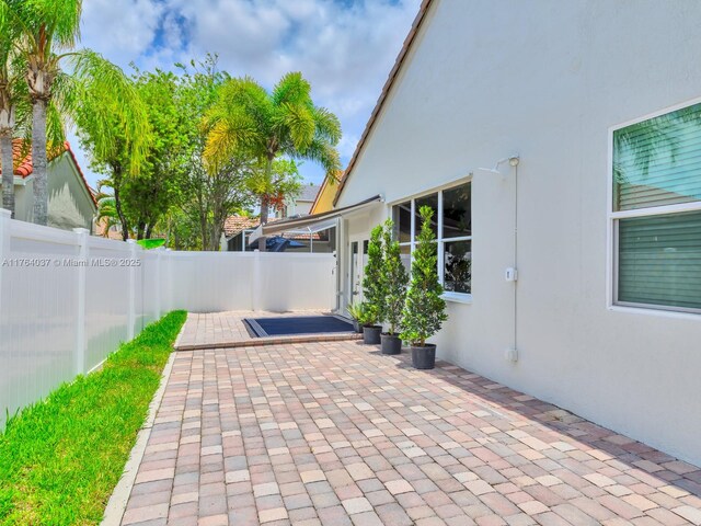 624 Stanton Dr, Weston, FL 33326 - fenced backyard with a patio area