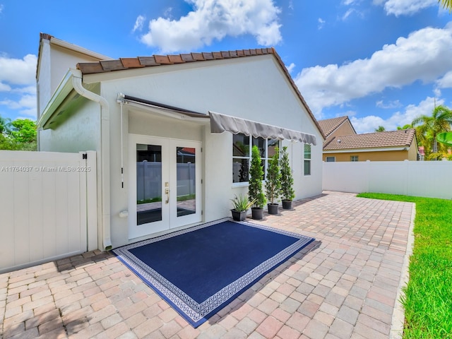 624 Stanton Dr, Weston, FL 33326 - rear view of property with french doors, a patio, and stucco siding