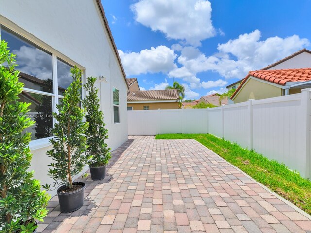624 Stanton Dr, Weston, FL 33326 - fenced backyard with a patio area