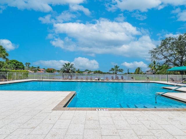 624 Stanton Dr, Weston, FL 33326 - community pool featuring a patio