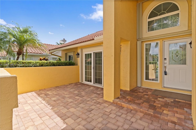 477 Spinnaker, Weston, FL 33326 - entrance to property featuring stucco siding, a patio area, and a tile roof