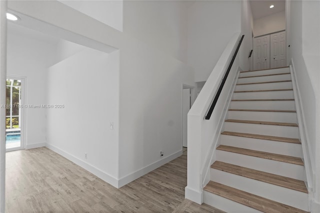 477 Spinnaker, Weston, FL 33326 - stairway featuring wood finished floors, baseboards, and recessed lighting