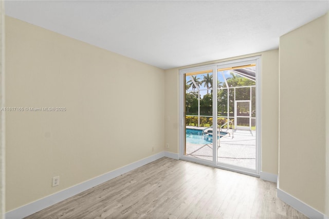 477 Spinnaker, Weston, FL 33326 - empty room featuring light wood finished floors and baseboards