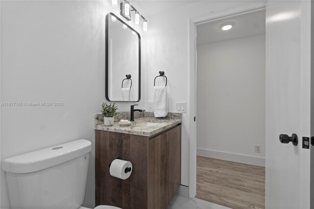 477 Spinnaker, Weston, FL 33326 - bathroom with toilet, vanity, and baseboards