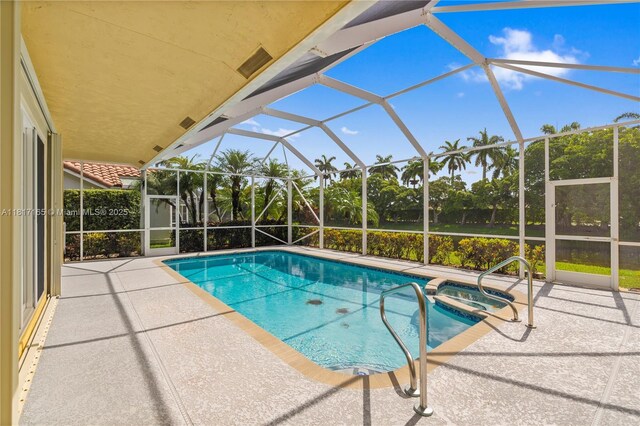 477 Spinnaker, Weston, FL 33326 - view of pool with a patio, glass enclosure, and a pool with connected hot tub