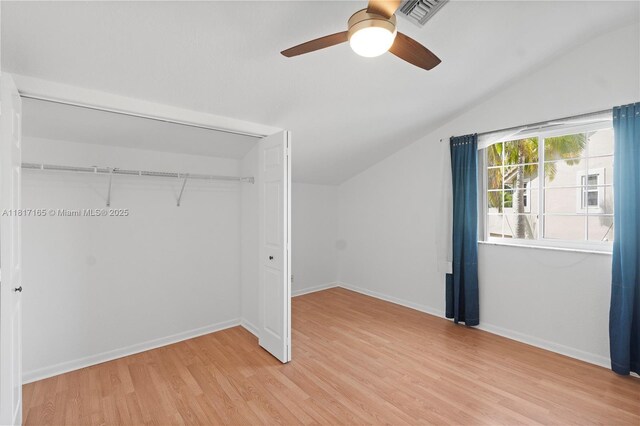 477 Spinnaker, Weston, FL 33326 - unfurnished bedroom featuring vaulted ceiling, light wood-style floors, a closet, baseboards, and ceiling fan