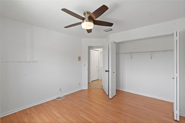 477 Spinnaker, Weston, FL 33326 - unfurnished bedroom featuring light wood-type flooring, baseboards, a closet, and a ceiling fan