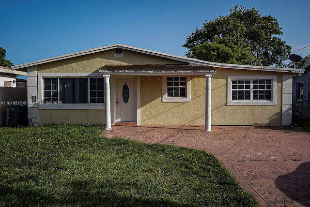 4250 SW 24th St, West Park, FL 33023 - view of front facade featuring stucco siding and a front lawn