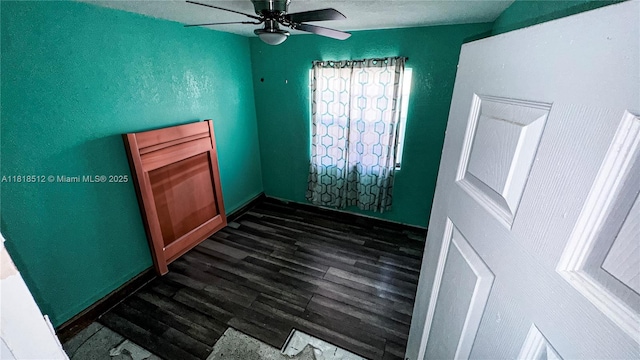 4250 SW 24th St, West Park, FL 33023 - unfurnished room with dark wood-style flooring, ceiling fan, and baseboards