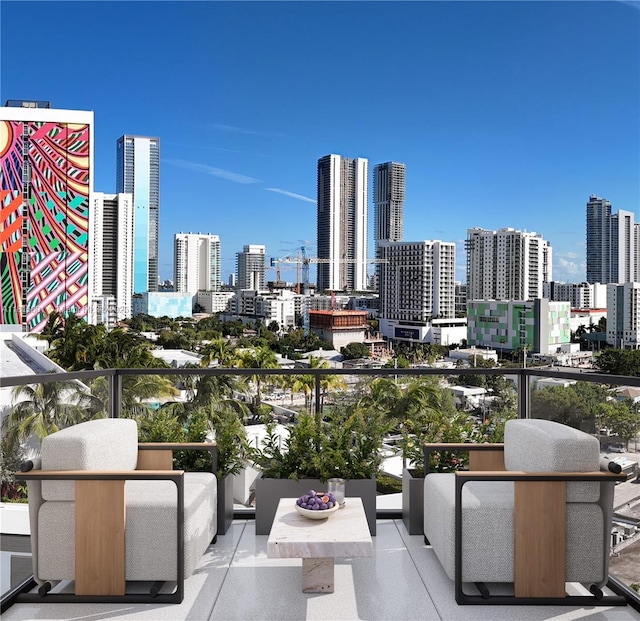 94 NE 29th St Unit 610, Miami, FL 33137 - balcony with a skyline view and outdoor lounge area